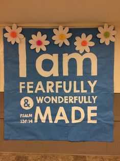 a blue and white sign that says i am fearlessly and wonderfully made