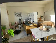 a living room filled with furniture next to a kitchen and dining room table in front of a bed