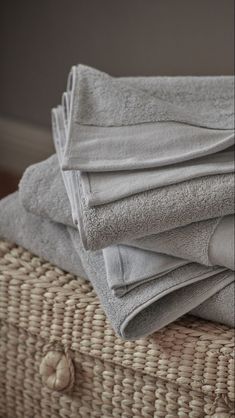 several folded towels are stacked on top of each other