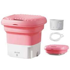 a pink and white portable device with accessories for hair care on a white background next to it