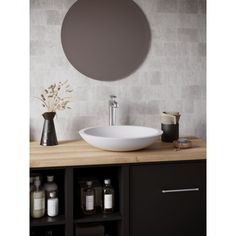 a white bowl sink sitting on top of a wooden counter next to a wall mounted mirror