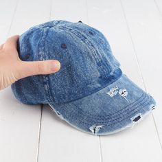 Light Denim Ripped Look Hat. Whether you are wanting a hat to dress up, or just to simply keep the sun out of your eyes this Light Denim Ripped Look Hat is just right for you. Spring Distressed Adjustable Baseball Cap, Distressed Adjustable Baseball Cap For Spring, Trendy Washed Snapback Hat, Adjustable Denim Visor Hat, Distressed Adjustable Spring Baseball Cap, Denim Snapback Baseball Cap For Spring, Denim Blue Baseball Cap For Spring, Trendy Washed Hat, One Size, Trendy Washed Hat One Size Fits Most