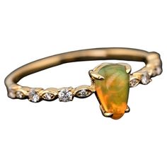 Minimalist Mexican Fire Opal Diamond Engagement Ring 18K Yellow Gold. Free Domestic USPS First Class Shipping! Free Gift Bag or Box with every order! Opal—the queen of gemstones, is one of the most beautiful gemstones in the world. Every piece of opal is unique in its own ways and patterns. We only use high-quality Natural Opals (NO synthetics or imitations) for our jewelry. ---------------------------------------------------------------------------------------------------- ABOUT THIS PRODUCT So Fire Opal Ring Engagement, Opal Diamond Engagement Ring, Mexican Fire Opal Ring, Beautiful Gemstones, Mexican Fire Opal, Fire Opal Ring, Opal Color, Natural Opal, Jewelry Rings Engagement