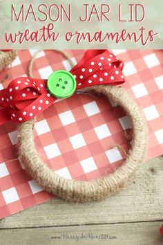 a red and white checkered table cloth with a green button on it that says mason jar lid wreath ornaments