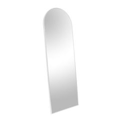 a white mirror sitting on top of a wall