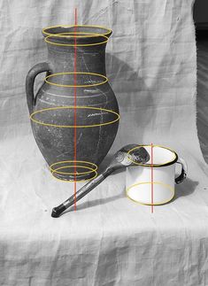 a black and white photo with yellow lines on the side of a vase next to two mugs