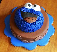 a birthday cake decorated to look like an evil cookie monster