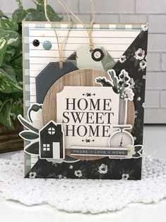 a handmade card with the words home sweet home on it, and a house