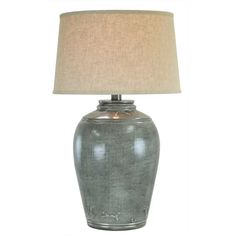 a gray table lamp with a beige shade