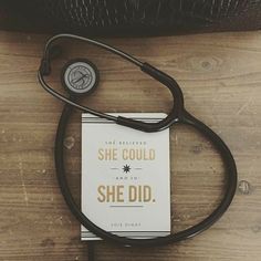 a book with a stethoscope on top of it that says she could and so she did