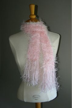 a mannequin with a pink scarf on it