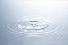 a water droplet with ripples in the middle