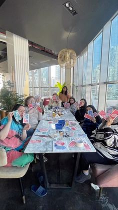 a group of people sitting around a table