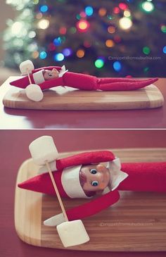 an elf laying on top of a wooden board