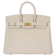 100% authentic Hermès Birkin 25 bag in Craie (cream) Veau Togo leather with gold-plated hardware. Lined in Chèvre (goat skin) with an open pocket against the front and a zipper pocket against the back. Has been carried once and is in virtually new condition. Protective stickers are intact except on tiret and back plate. Comes with key,lock, clochette, dust bag and receipt. Measurements Model H041344CC 10 Height 20cm (7.8in) Width 25cm (9.8in) Depth 13cm (5.1in) Drop of the Handle 5.5cm (2.1in) H Luxury Purses Hermes Birkin, Hermes Himalayan, French Tote Bag, Embroidered Shoulder Bag, Expensive Bag, Cream Bags, Hermes Birkin 25, Togo Leather, Kelly Bag