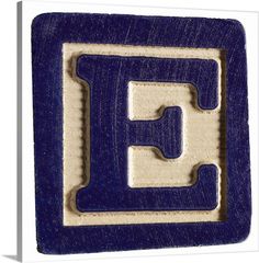 the letter e is made out of wood and has blue paint on it's edges