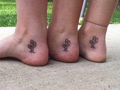 3 women’s inner ankles. There is a  saguaro cactus with some spines on it, with a line as the dirt and a couple small pebbles beneath. Small Western Ankle Tattoo, Western Sibling Tattoos, Nopales Tattoo, Matching Cactus Tattoos, Inner Foot Tattoo, Small Arizona Tattoo, Cacti Tattoos