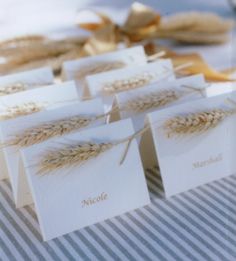 small cards with wheat on them sitting on a table