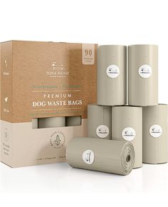 six rolls of dog waste bags in front of a cardboard box with the packaging on it