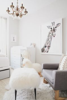 an instagram photo with a giraffe on the wall and a chair in the foreground