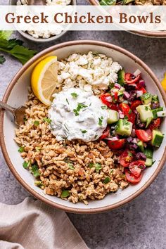 greek chicken bowls with cucumbers, tomatoes, and feta cheese on the side