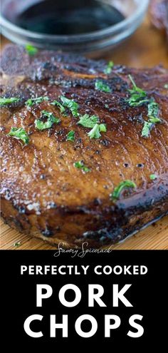 pork chops on a cutting board with sauce in the background