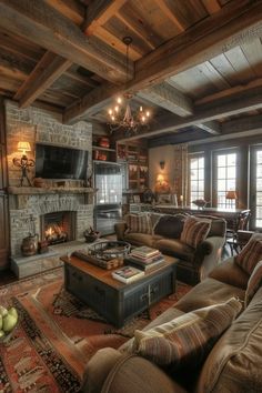 a living room filled with furniture and a fire place in the middle of a room