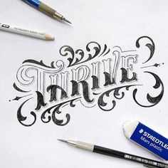 an ink pen and some type of lettering