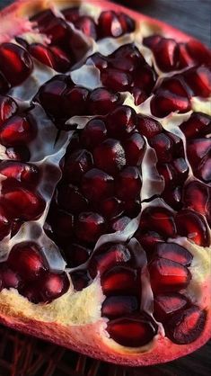 a pomegranate that has been cut open and is sitting on a table