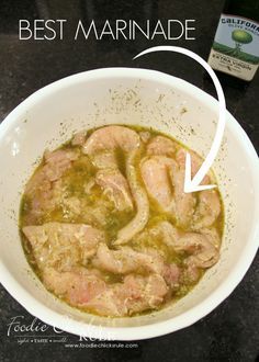 a white bowl filled with food next to a bottle