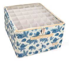 a blue and white storage box with pineapples on the front, inside it