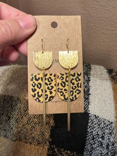 Free Shipping to US addresses The Maggie style: modern statement dangle earrings in polymer clay and brass Very lightweight, in leopard print animal print tan and black Hypoallergenic gold coated ear wires handmade jewelry gift idea for a fashion lover, classic and professional All my earrings are handmade and slight variations in color and texture may occur Animal Print Jewelry, Funky Jewelry, Handmade Jewelry Gift, Geometric Jewelry, Modern Earrings, Earrings Boho, Boho Earrings, Clay Jewelry, Ear Wires