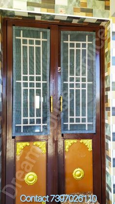 two wooden doors with glass panels on them