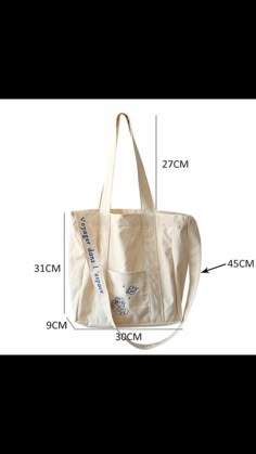 a white tote bag with measurements for the bottom and side zippers on it