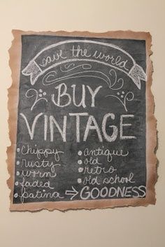 a chalkboard sign that says buy vintage