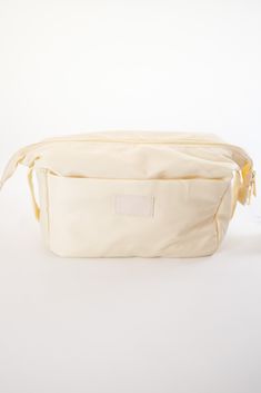 Made of Nylon Approximately 9.5 x 4.5 x 6.3 inches Gold Hardware Outer pocket Cosmetic Bum Bag, Cosmetic Pouch, Makeup Pouch, Travel • Made in United States Nylon Pouch Shoulder Bag With Zipper, Cream Nylon Shoulder Bag For Travel, Cream Travel Bag With Zipper Pouch, Cream Zipper Pouch For Travel, Beige Nylon Bag With Cell Phone Pocket, Cream Shoulder Bag With Zipper Pouch For Travel, Nylon Zipper Pouch Bag, Nylon Pouch With Zipper, Cream Nylon Travel Bag