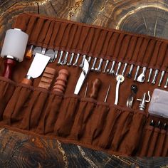 an assortment of kitchen utensils in a brown case