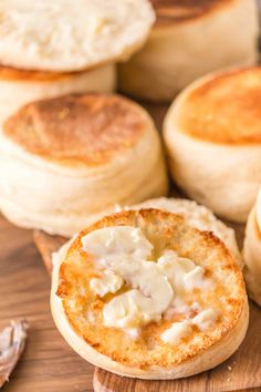 there are several different types of biscuits on the table, including one with cream cheese