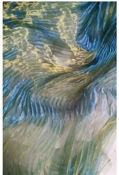 blue and green wavy fabric with white background