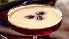 a close up of a drink in a glass on a table