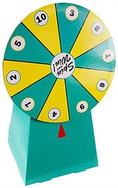 a toy spinning wheel with numbers on the front and sides, sitting on top of a blue stand