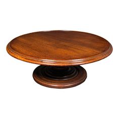 a round wooden table on a white background