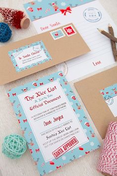 the wedding stationery is decorated with red, white and blue yarn