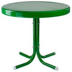 a green table with two white legs and a round glass top on an isolated pedestal