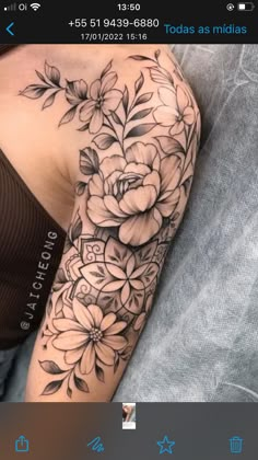 a woman with a flower tattoo on her arm