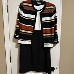 Studio One Black & White Dress W/Back Zipper. Removable Jacket Stripped In Black, Off White, Rust, Tan, And Taupe. Sleeves Are 3/4 Length With Gold Button Accent. Size 10. Light Weight 95% Polyester 5% Spandex. Removed Tags And Tried On But Never Worn. 2 Piece Suit, Suit Dress, Black White Dress, 2 Piece, Dress Shop, Sleeveless Dress, White Dress, Size 10, Dresses Skirts