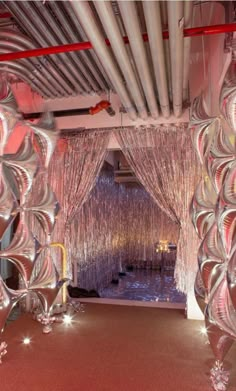 an elaborately decorated room with red carpet and white curtains