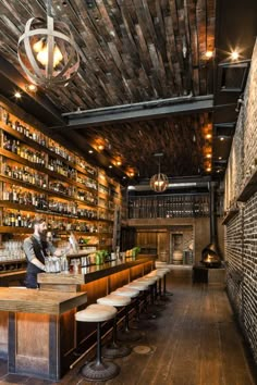 a bar with lots of bottles on the shelves