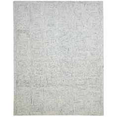 a white rug with grey squares on it