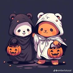 two teddy bears dressed in halloween costumes holding jack - o'- lantern pumpkins